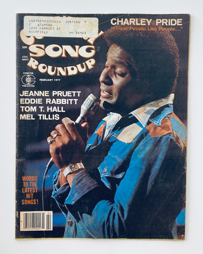 Cover of Country Song Roundup Magazine February 1977 featuring Charley Pride with an article on Jeanne Pruett, Eddie Rabbitt, Tom T. Hall, and Mel Tillis, showcasing the influential country music scene of the 1970s.