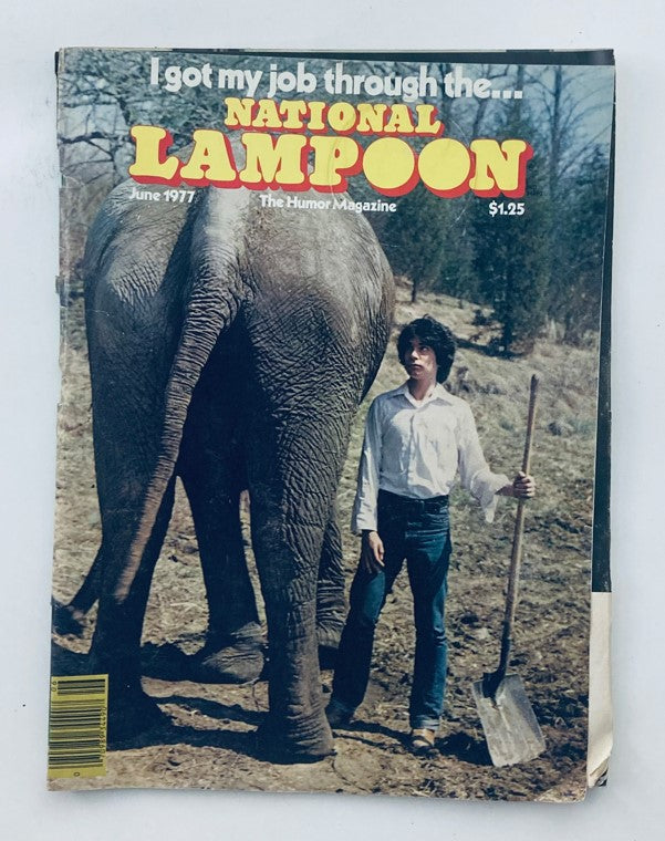Cover of Vtg National Lampoon Magazine June 1977 featuring a humorous image of a man with a shovel standing next to an elephant, showcasing the edition titled 'Operation Turn Rubber', a rare collectible.