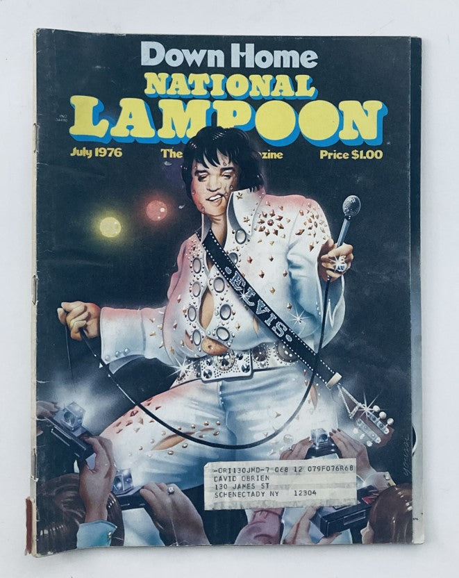 Cover of Vintage National Lampoon Magazine July 1976 featuring a colorful illustration of Elvis Presley performing, adorned in a sparkling jumpsuit and surrounded by fans holding cameras.
