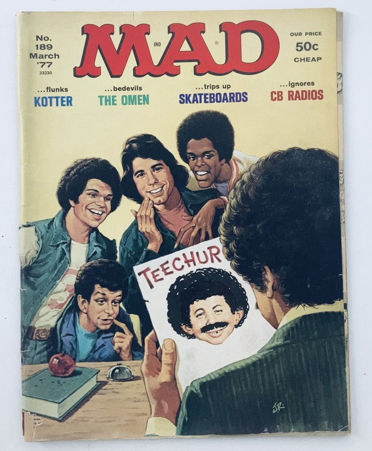 Vintage Mad Magazine cover from March 1977, issue No. 189, featuring a humorous illustration of young adults around a table, along with references to various pop culture themes, including skateboards and 'The Omen'. VTG Mad Magazine December 1976 No. 187 Henry Winkler The Fonz 4.0 VG No Label.
