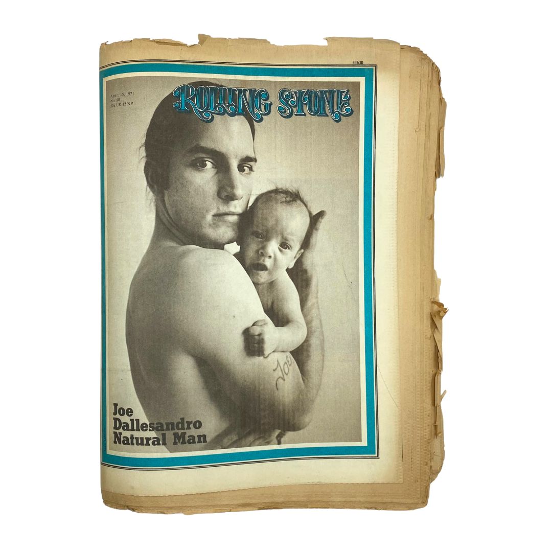 Cover of Rolling Stone Magazine, April 15, 1971, featuring Joe Dallesandro with a baby, showcasing the iconic style of vintage magazine art and the cultural significance of the 1970s.