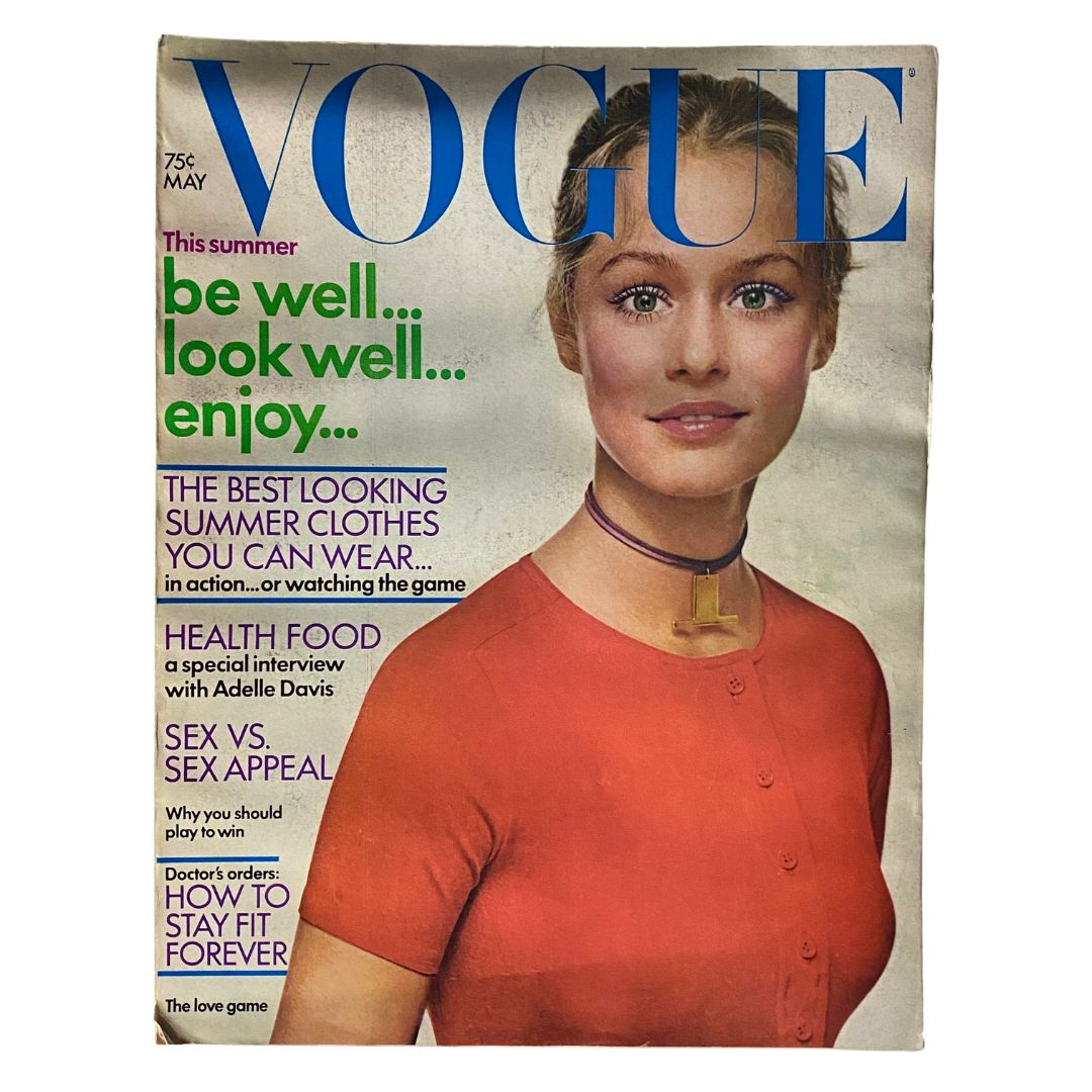 VTG Vogue Magazine May 1971 featuring Lauren Hutton on the cover, showcasing a vintage fashion aesthetic with bold colors and a striking design.
