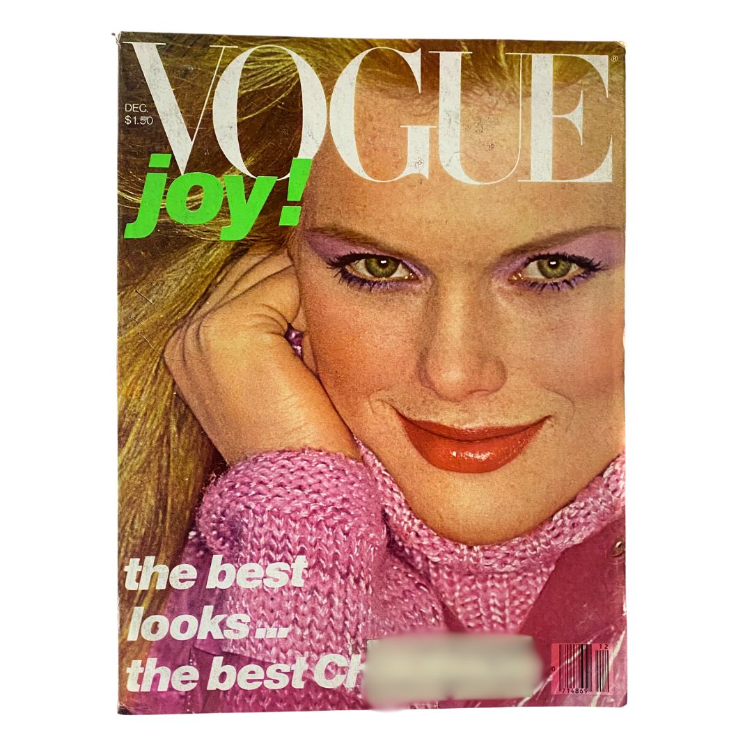 VTG Vogue Magazine December 1977 cover featuring Patti Hansen, captured by Patrick Demarchelier, showcasing vintage fashion aesthetics with a joyful theme.