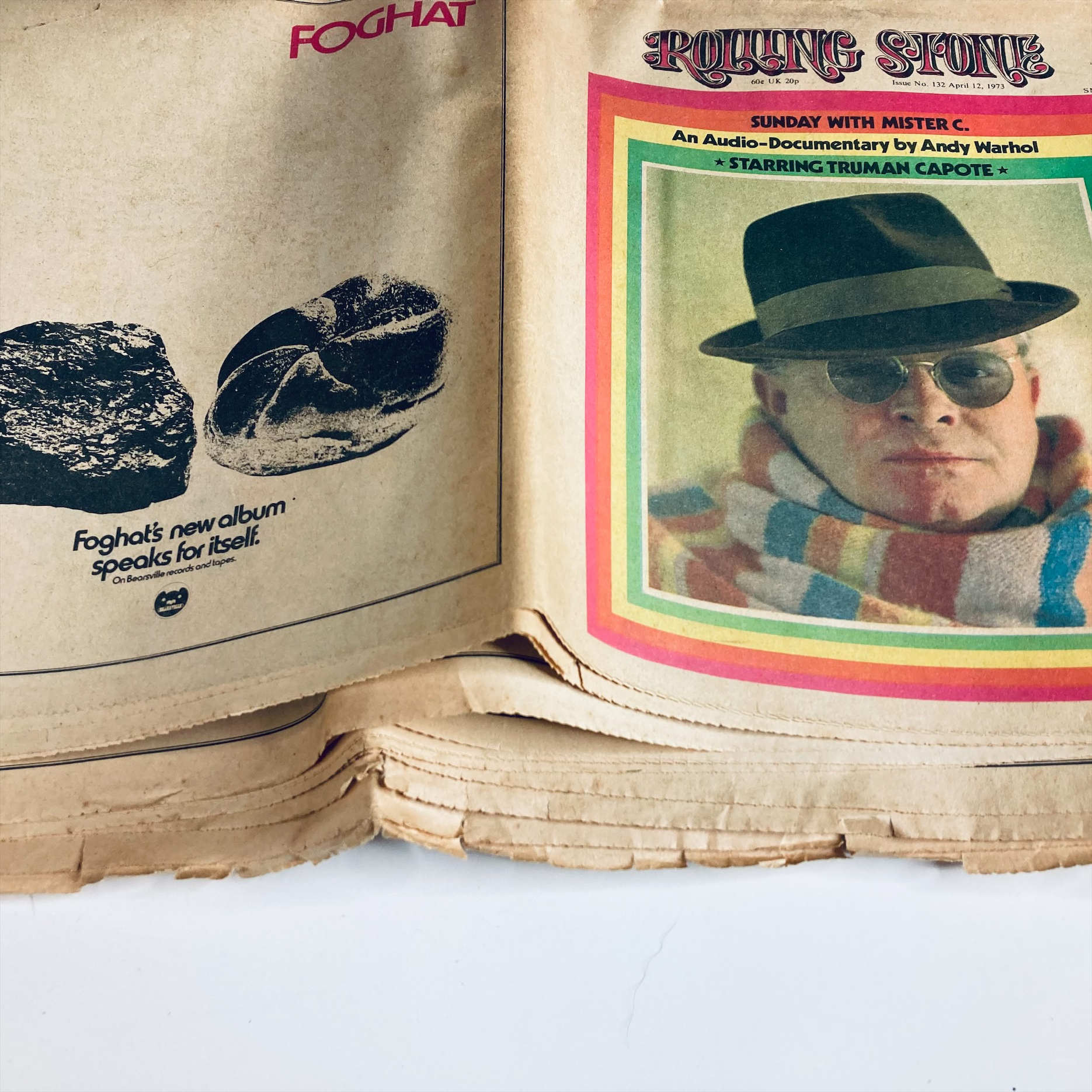 Inside spread of VTG Rolling Stone Magazine April 12, 1973 Issue No. 132 showing the advertisement for Foghat alongside the cover image of Truman Capote.