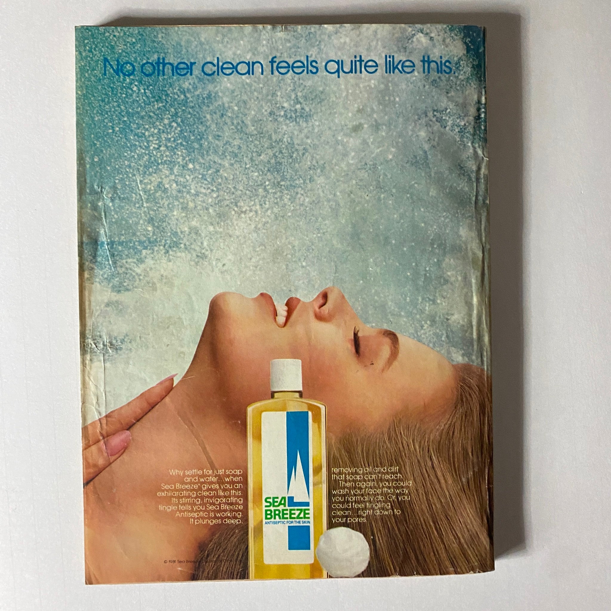 Glamour Magazine July 1981 advertisement for Sea Breeze Antiseptic showcasing a model with a serene expression, emphasizing the refreshing clean feeling.