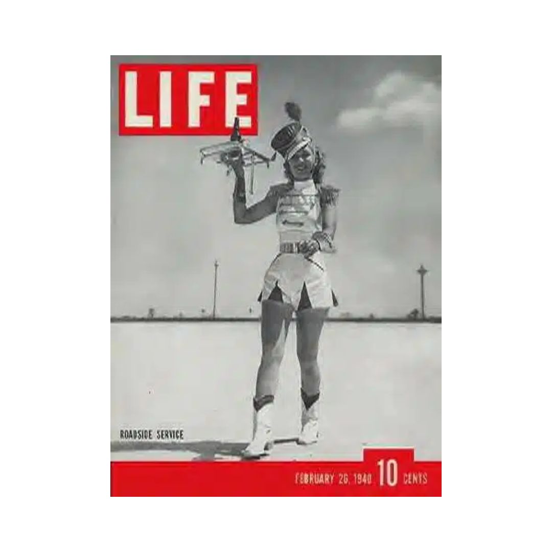 VTG Life Magazine February 26, 1940 cover depicting a woman in a vintage uniform holding a toy plane, showcasing the Houston Drive-In theme.