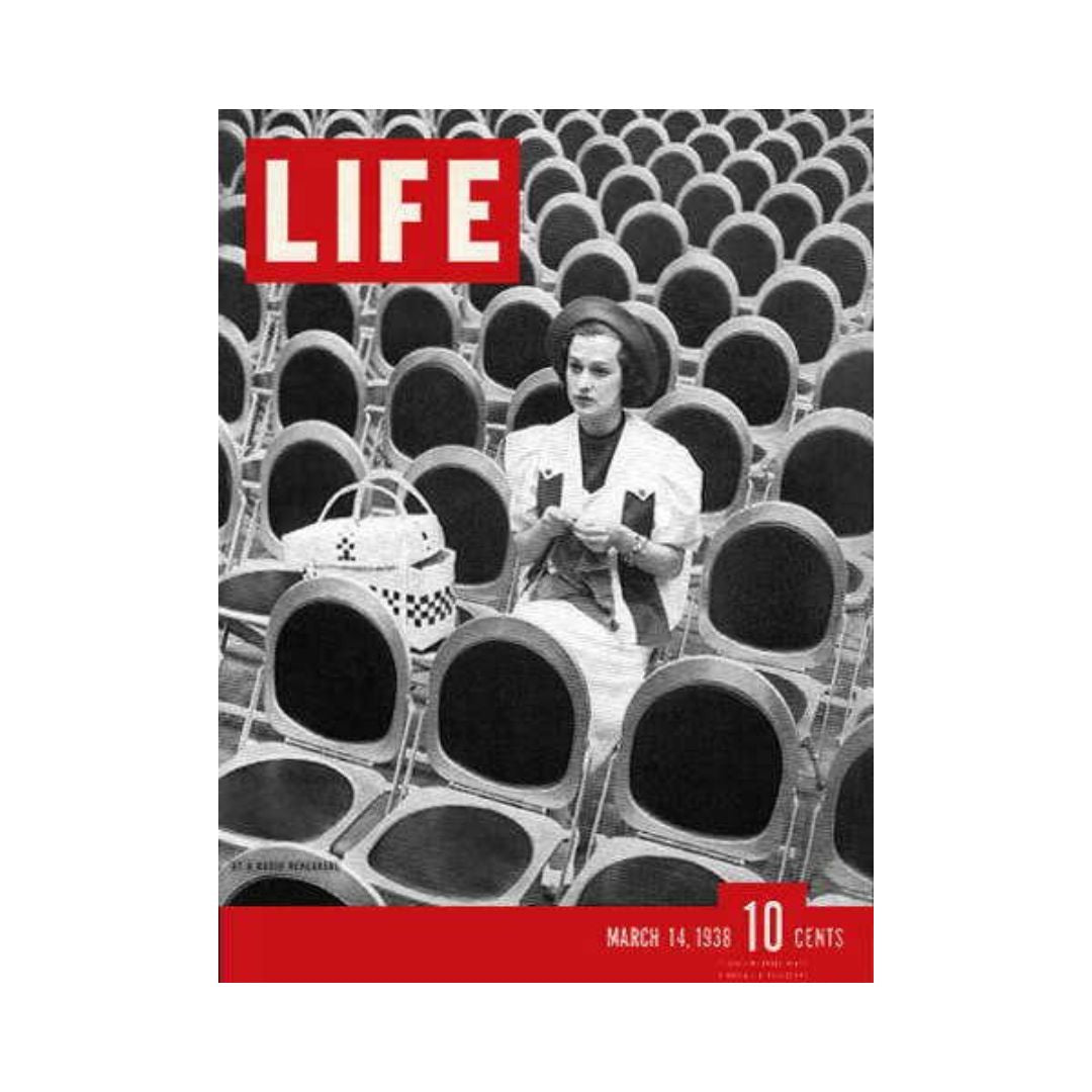 Cover of VTG Life Magazine March 14, 1938 featuring a woman seated among empty chairs, showcasing the vintage design and style of the era.