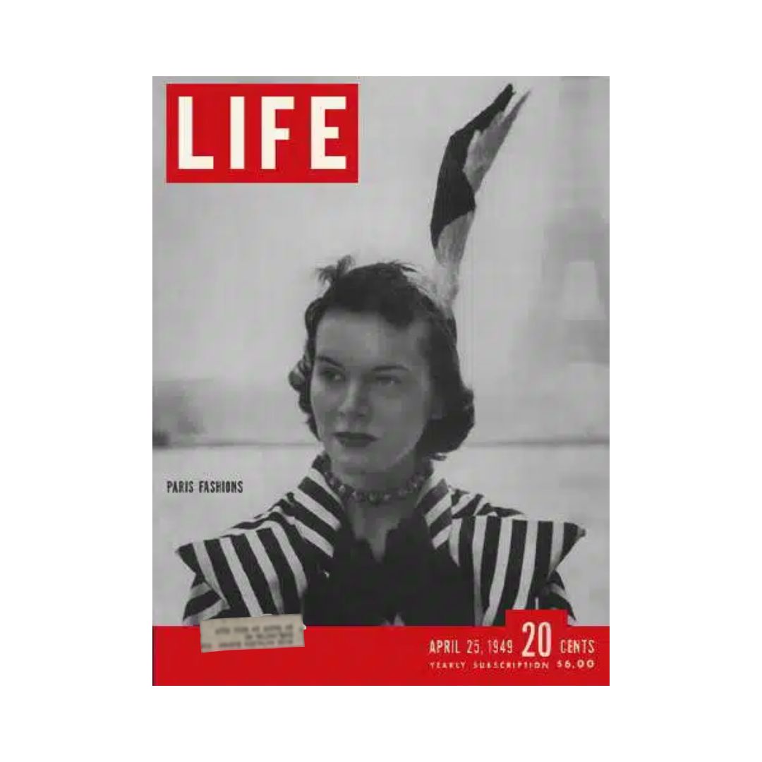 Cover of VTG Life Magazine April 25, 1949 featuring Paris Fashions, showcasing a woman in elegant, striped attire with a striking feather in her hair.