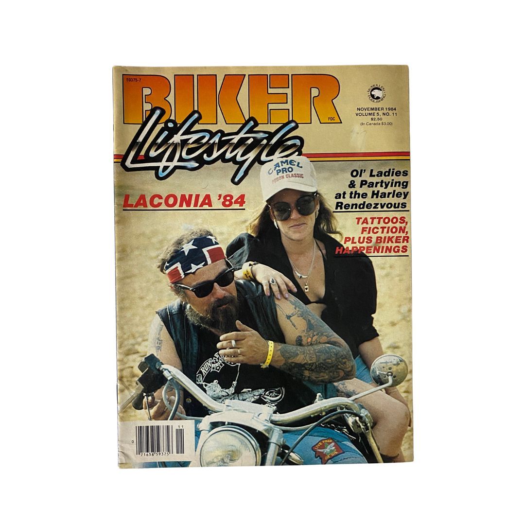 Cover of VTG Biker Lifestyle Magazine November 1984 featuring a biker couple with the title 'Laconia '84'. The image captures the essence of biker culture with its vibrant colors and bold typography.