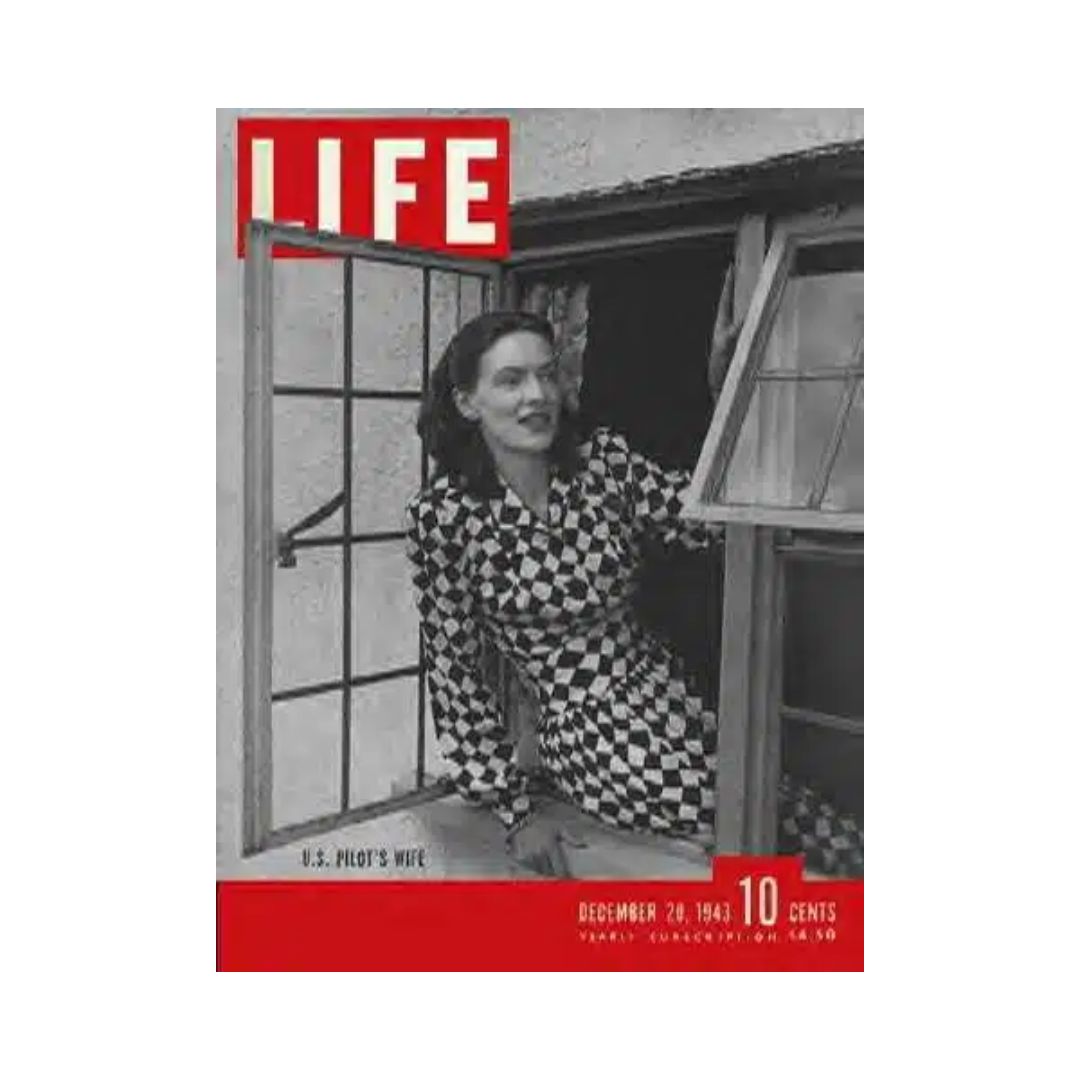 VTG Life Magazine cover from December 20, 1943 featuring U.S. Pilot's Wife Muriel Stanhope, showcasing a woman in a stylish black and white patterned dress, peering out of a window.