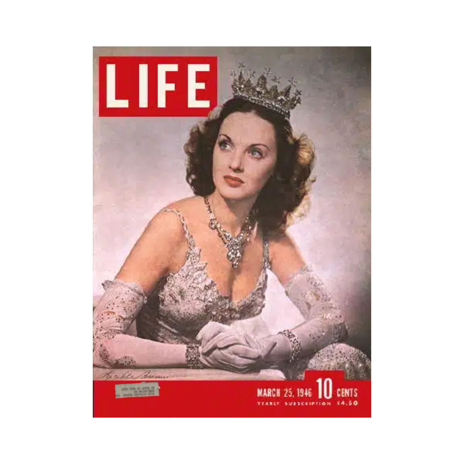 Vintage Life Magazine cover from March 25, 1946, featuring actress and dancer Lucille Bremer, adorned in pearls and a crown, showcasing iconic mid-20th century fashion.