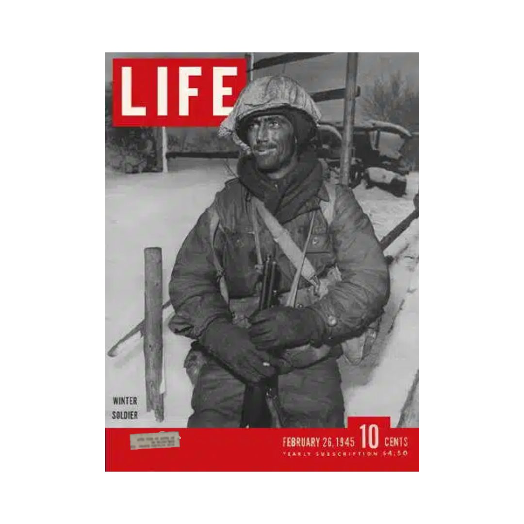 Cover of VTG Life Magazine from February 26, 1945, featuring Winter Soldier Private George Kelly, showcasing a soldier in winter attire with a rifle, capturing a significant moment from World War II.