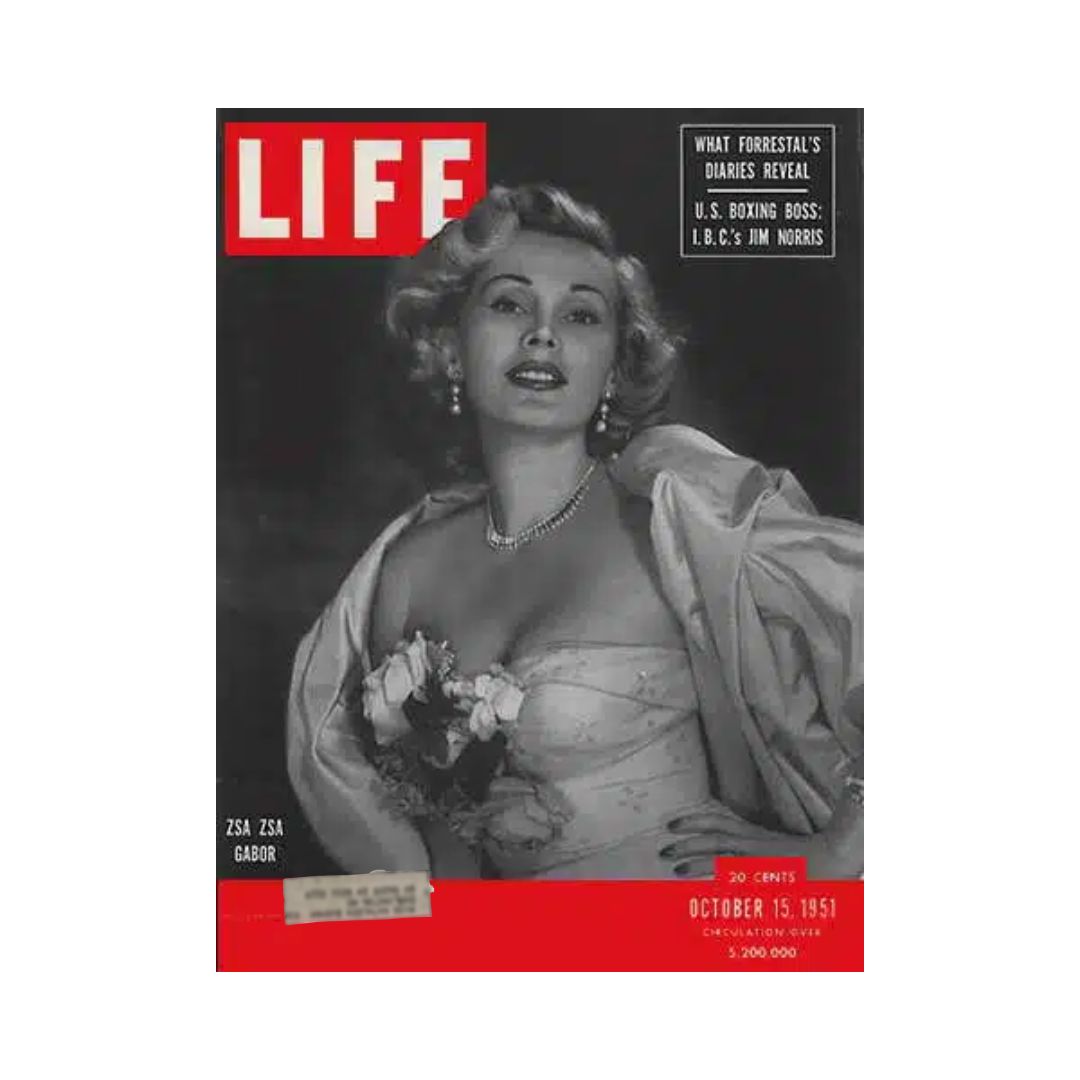 VTG Life Magazine cover from October 15, 1951 featuring Zsa Zsa Gabor, renowned socialite and actress, showcasing her glamorous style in a beautiful gown with floral accents.