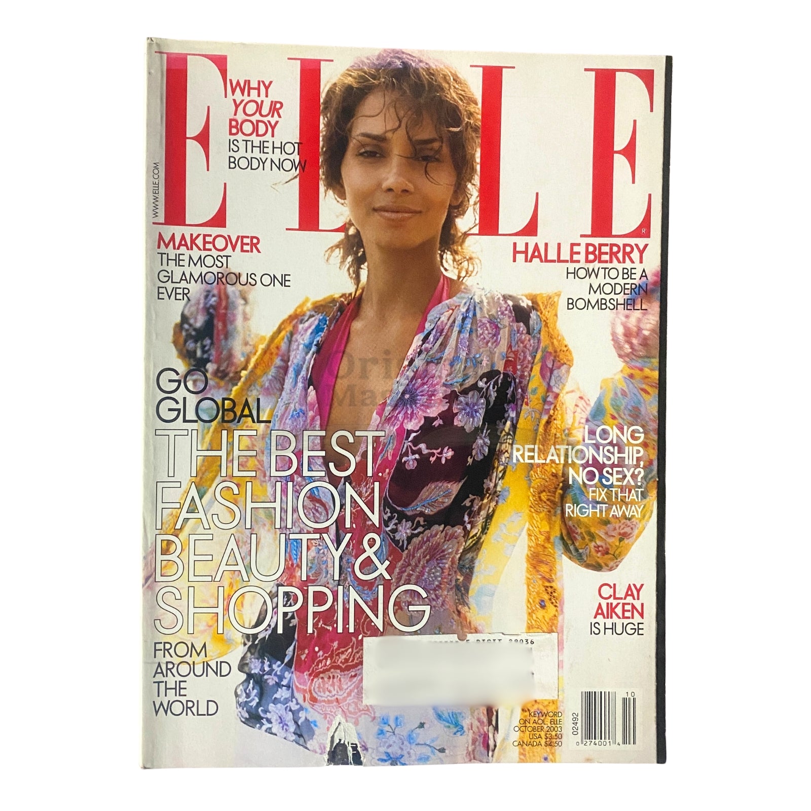 Elle Magazine October 2003 cover featuring Halle Berry, showcasing fashion, beauty, and shopping insights along with celebrity interviews and cultural trends.