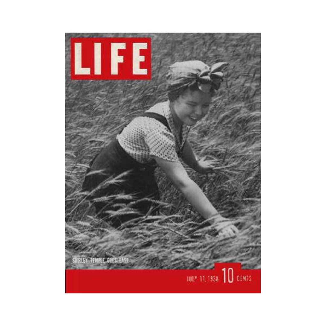 Vintage Life Magazine July 11, 1938 cover featuring Hollywood actress Shirley Temple in a scenic field, showcasing a nostalgic piece of entertainment history.