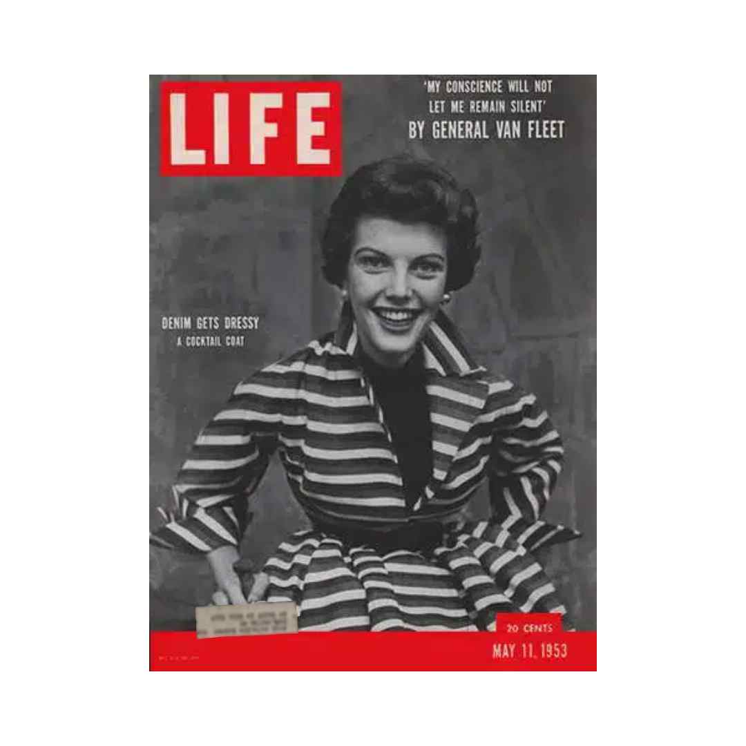 Cover of VTG Life Magazine May 11, 1953 featuring denim fashion with a smiling model in a striped cocktail coat, illustrating 1950s fashion trends.