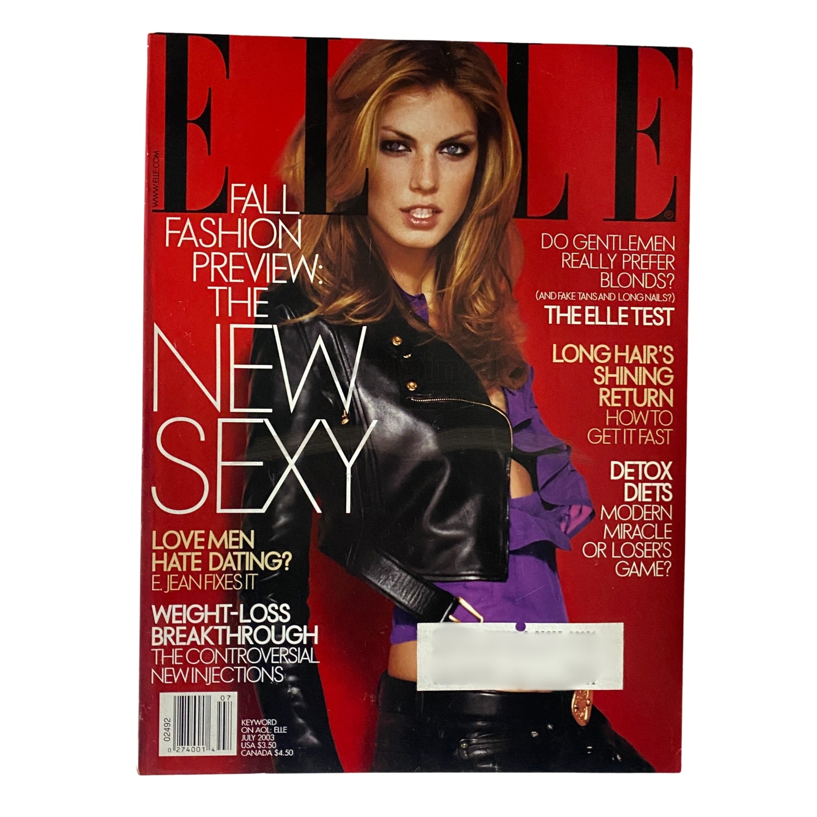 Elle Magazine July 2003 cover featuring Angela Lindvall, showcasing early 2000s fashion trends and culture.