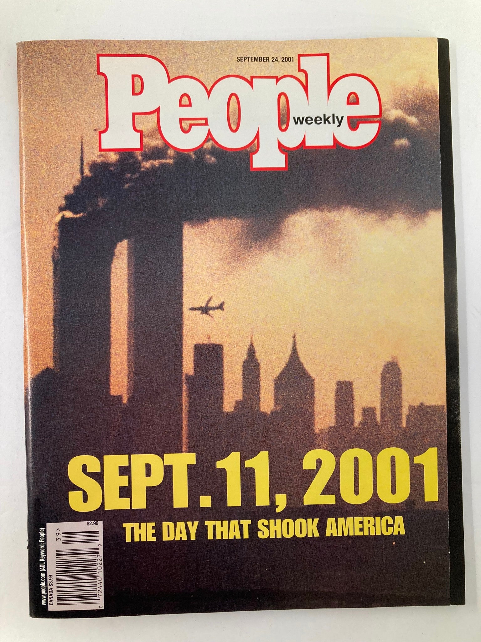 People Weekly Magazine September 24 2001 cover featuring the Twin Towers with fiery smoke and text reading 'SEPT. 11, 2001 - THE DAY THAT SHOOK AMERICA'.