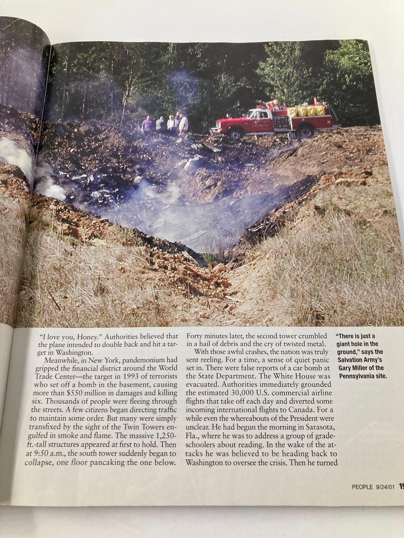Interior page of People Weekly Magazine September 24 2001 depicting the aftermath of the September 11 attacks with authorities at work and textual details about the events.