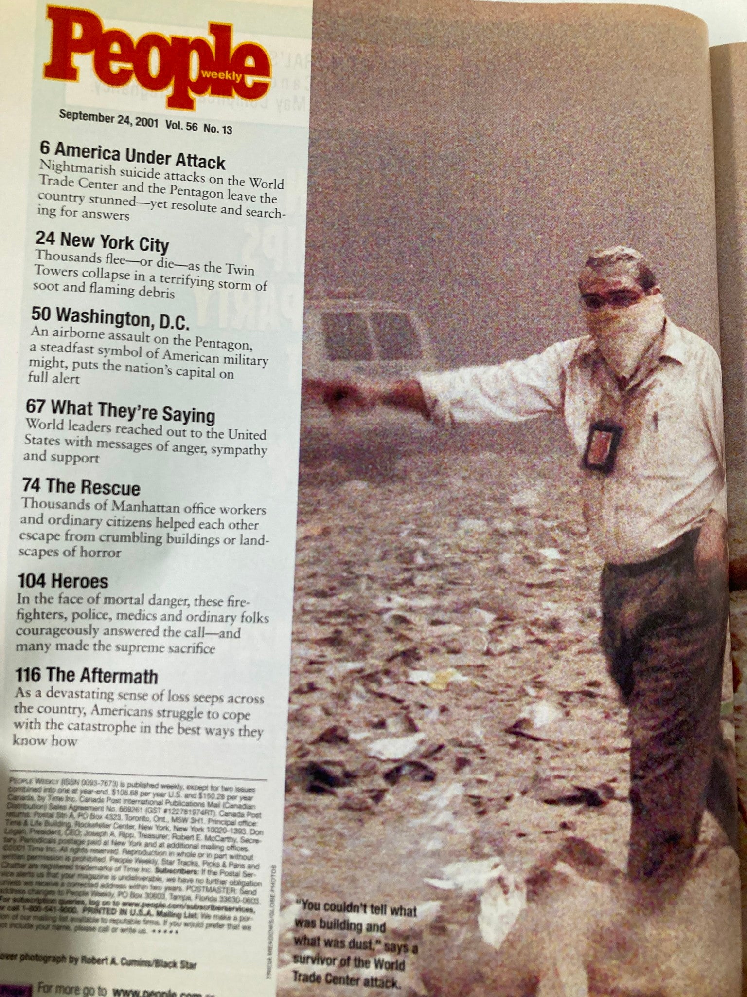 Image from People Weekly Magazine September 24 2001 showing a rescue worker responding to the September 11 attacks, highlighting the urgent and chaotic atmosphere.