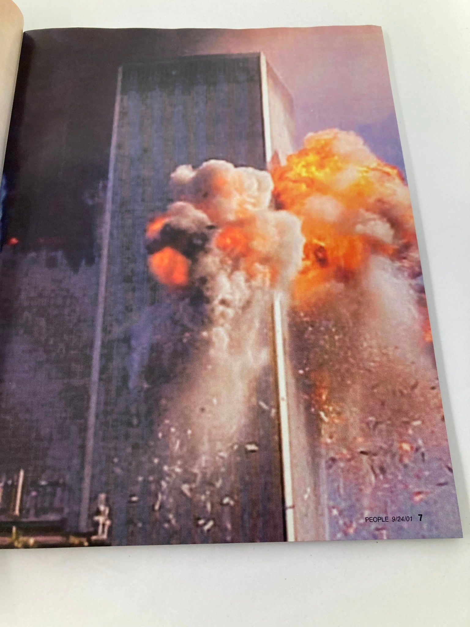 Dramatic image from People Weekly Magazine September 24 2001 capturing the explosion and debris of the Twin Towers during the September 11 attacks.