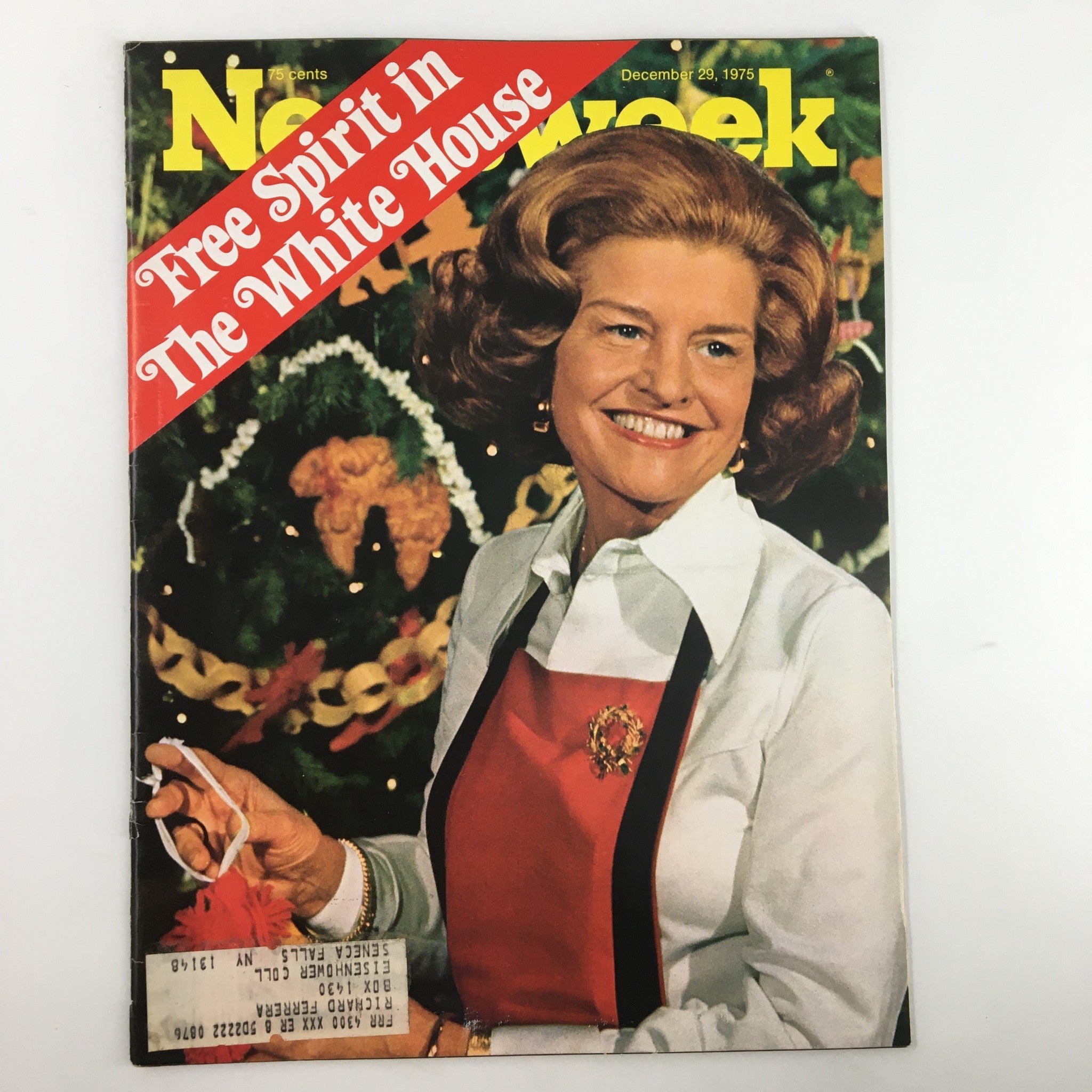 Cover of the vintage Newsweek magazine from December 29, 1975 titled 'Free Spirit in The White House', featuring a smiling woman with medium-length curled hair, dressed in a white shirt with a red apron, holding a decorative holiday item against a festive background.