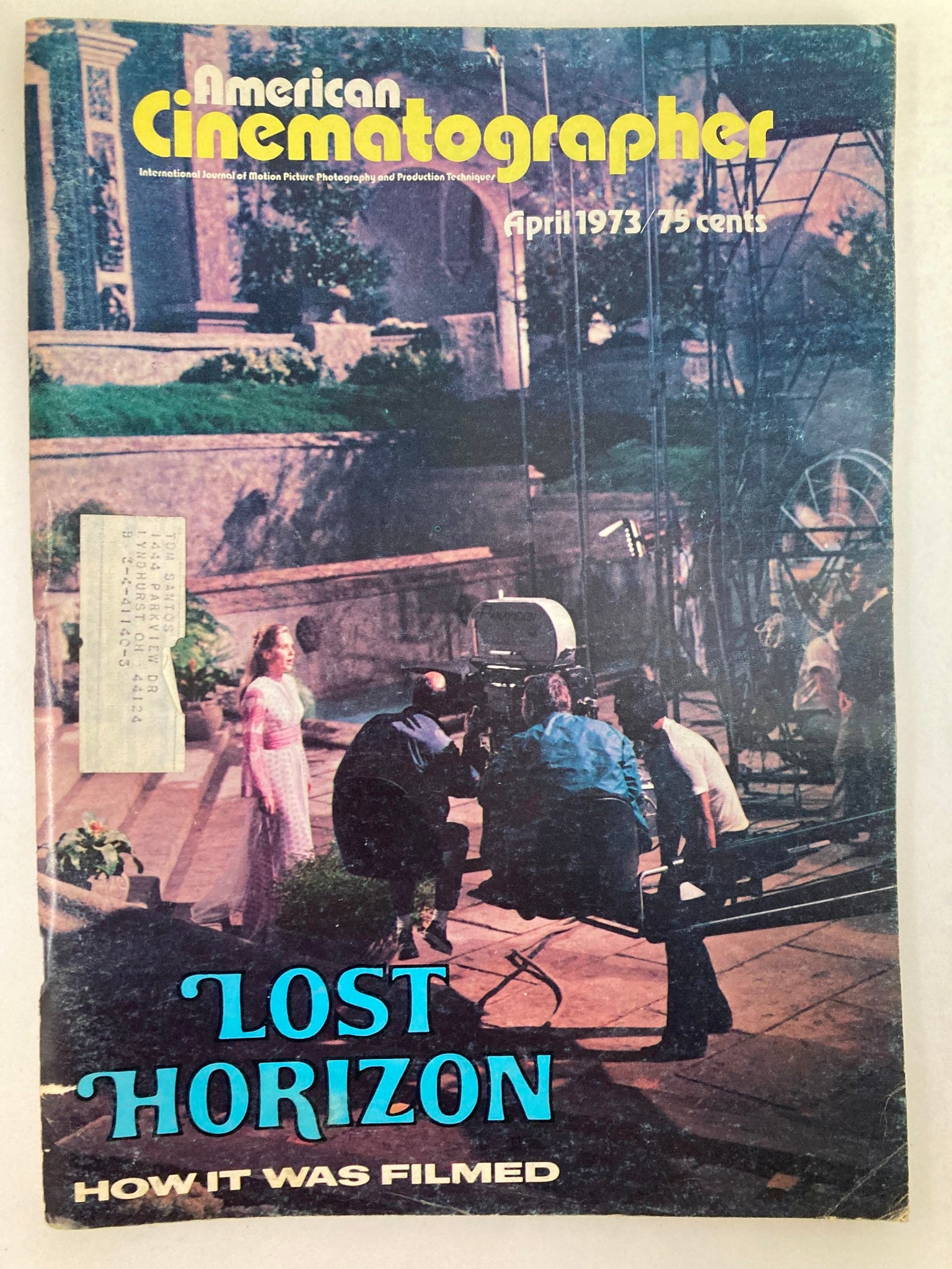 Cover of American Cinematographer Magazine, April 1973 featuring Liv Ullman in 'Lost Horizon,' showcasing a film crew scene behind the camera.
