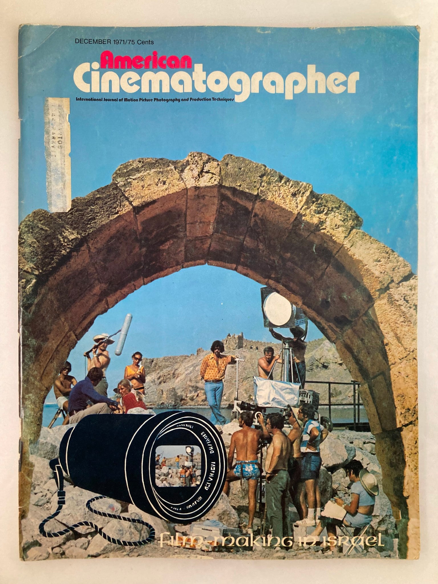 Cover of American Cinematographer Magazine December 1971 featuring a filmmaking scene in Eilat, Red Sea, showcasing a film crew and equipment against a scenic backdrop.