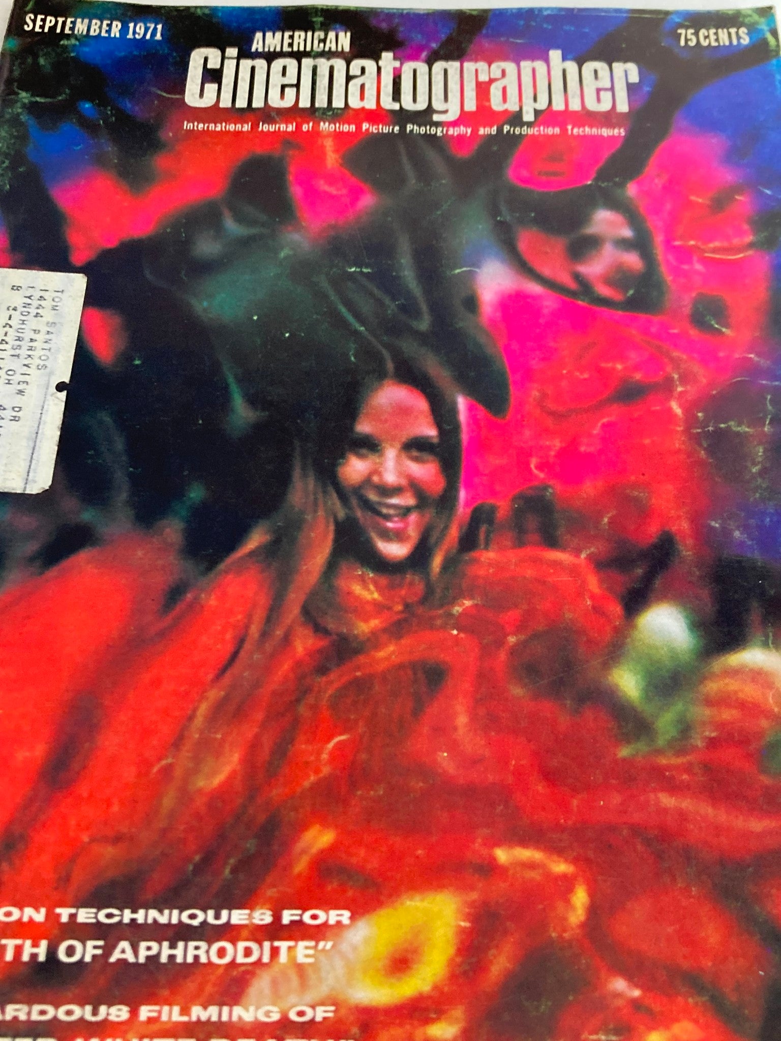 Close-up of the cover of American Cinematographer Magazine September 1971, highlighting the title 'The Birth of Aphrodite' with a colorful background and photographic elements representing the film industry.