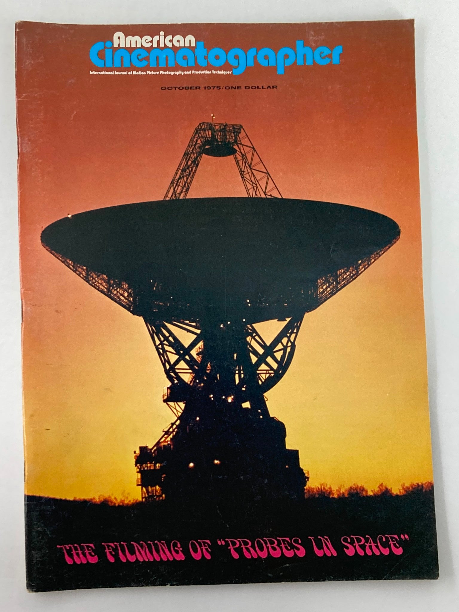 Cover of American Cinematographer Magazine October 1975 featuring a silhouette of a large dish telescope against a sunset, with the title 'The Filming of Probes in Space' prominently displayed.
