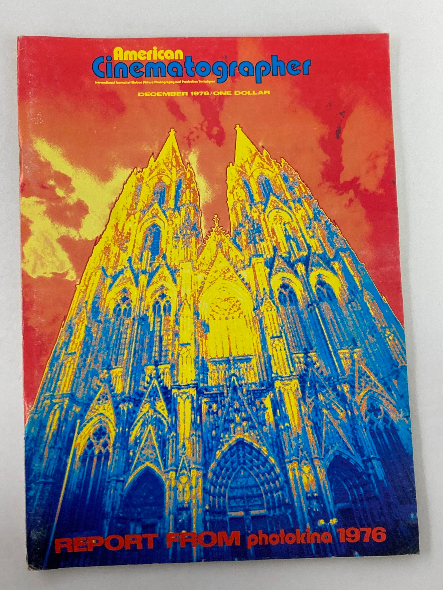 Cover of American Cinematographer Magazine December 1976 featuring a vibrant stylized image of the Famous Cologne Cathedral, highlighting the theme of cinematography.