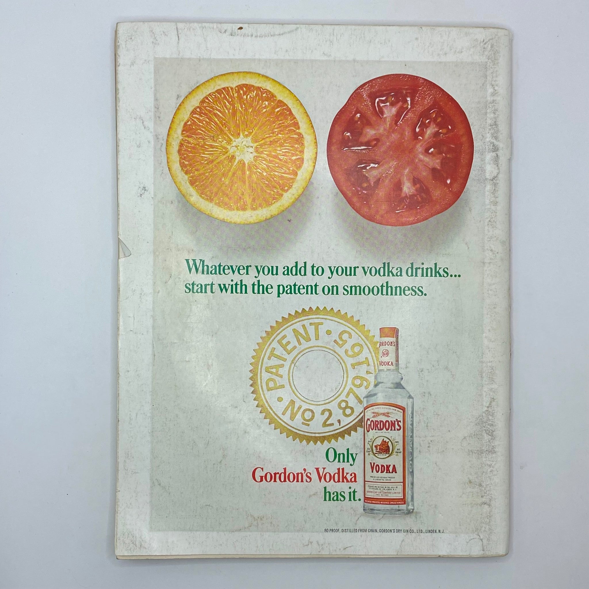 Gordon's Vodka advertisement featuring a sliced orange and tomato. The ad highlights the smoothness of Gordon's Vodka, emphasizing its patented quality, featured in Playboy Magazine May 1968 with Playmate Elizabeth Jordan.