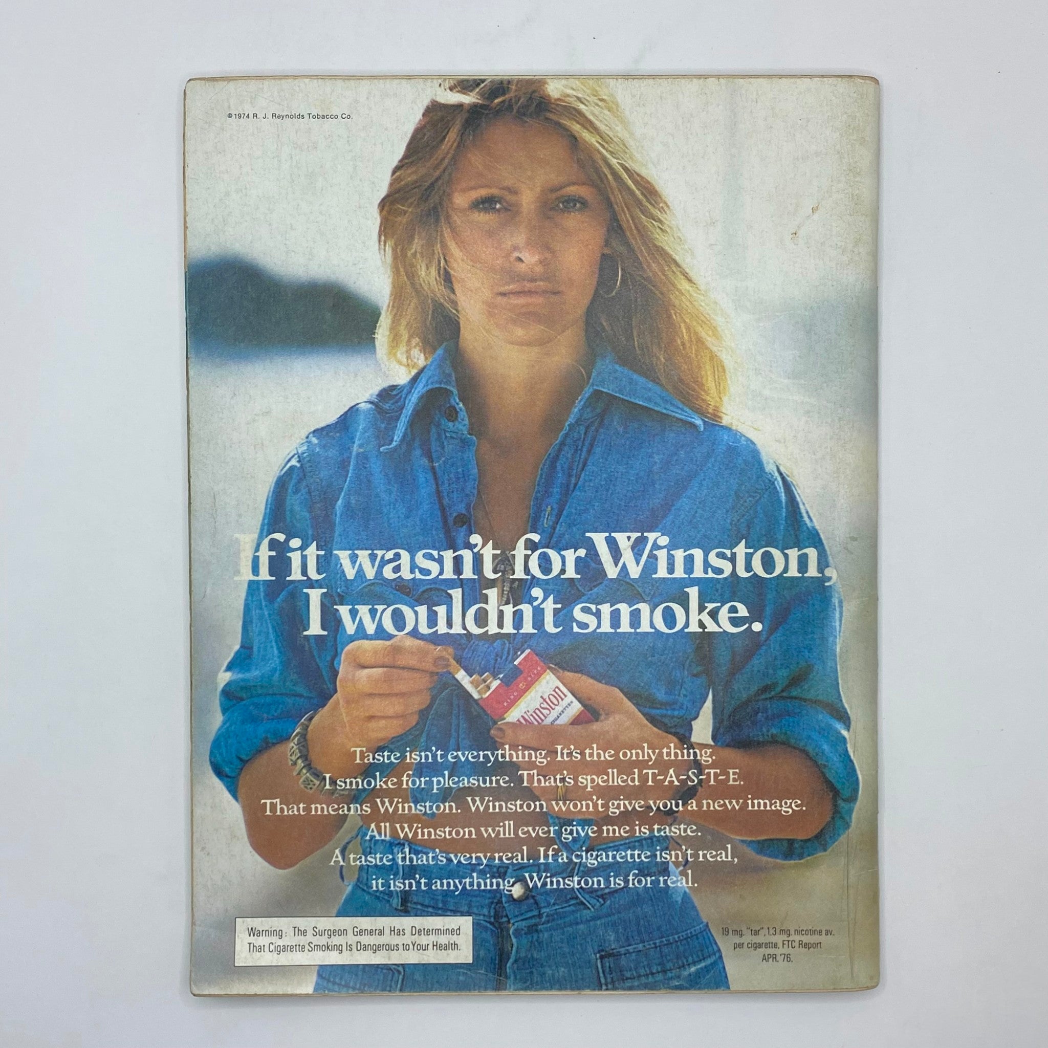 Back cover of Playboy Magazine February 1977 featuring a vintage advertisement for Winston cigarettes.