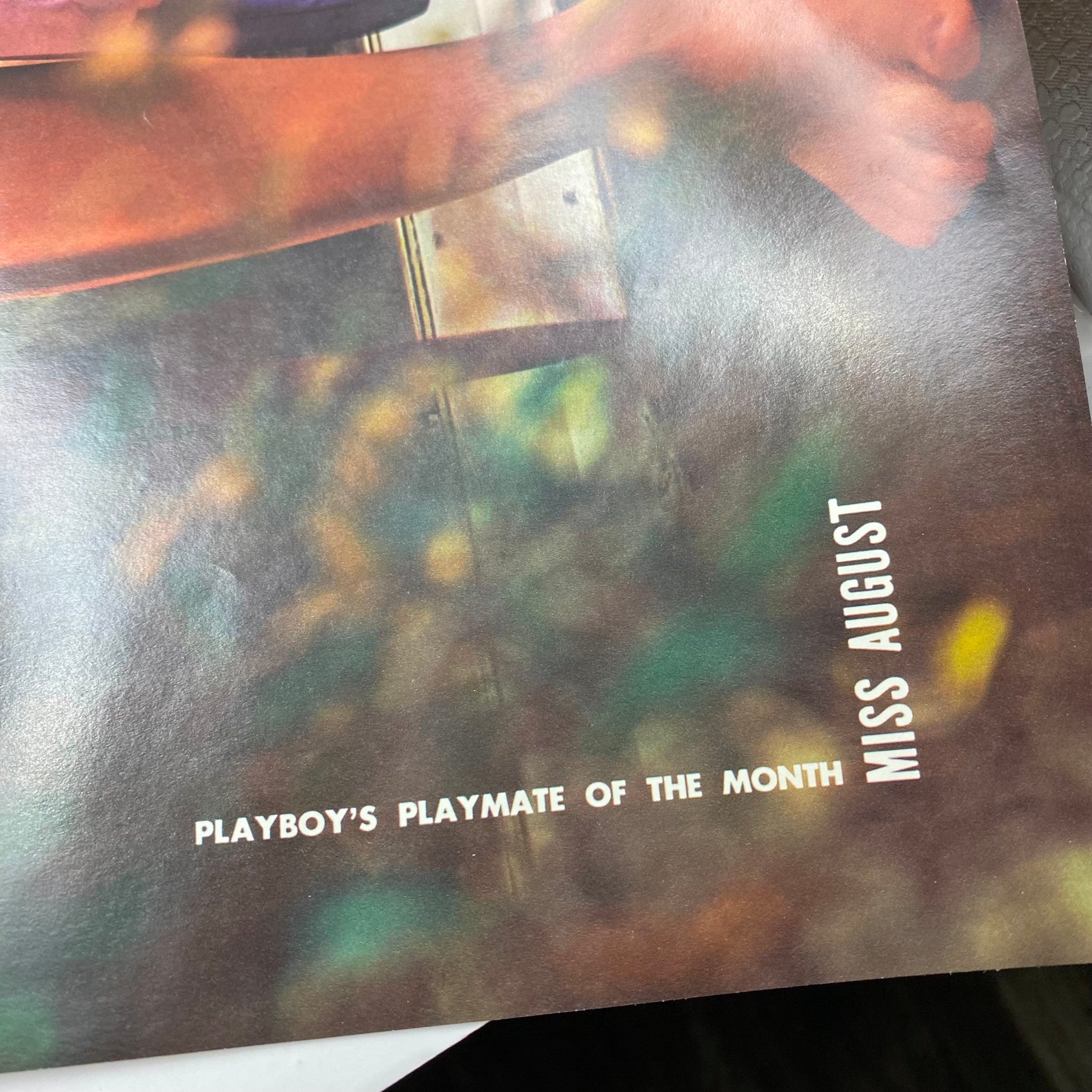 Close-up of the Playboy Magazine August 1974 interior page highlighting 'Miss August' text, emphasizing the Playmate of the month feature.