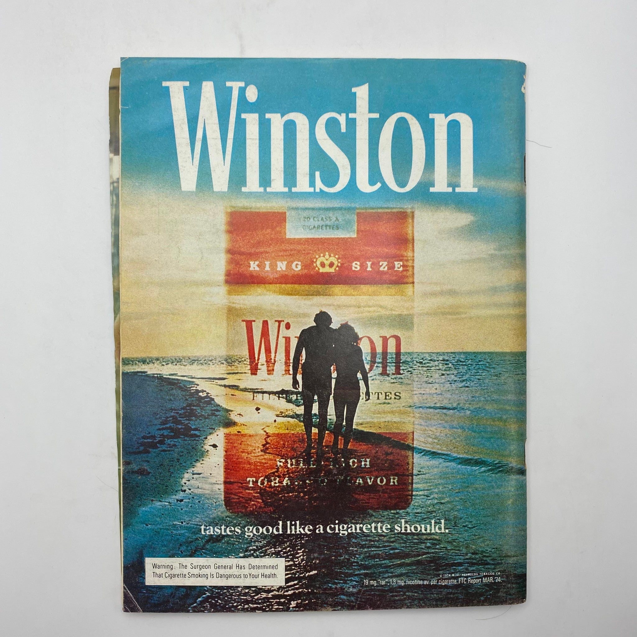 Winston cigarette advertisement showcasing a scenic beach image, echoing the retro aesthetics of the 1970s, featured in Playboy Magazine August 1974.