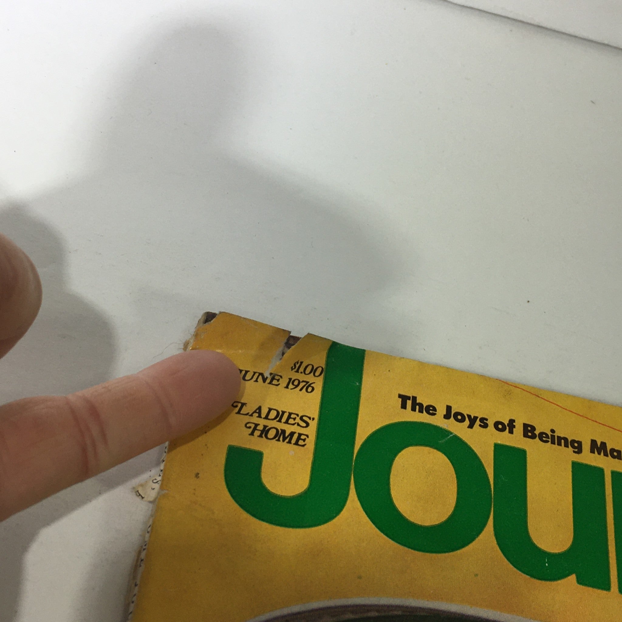 Close-up view of the top edge of VTG Journal Magazine: June 1976, showing the magazine price and publication date, with slight wear visible.