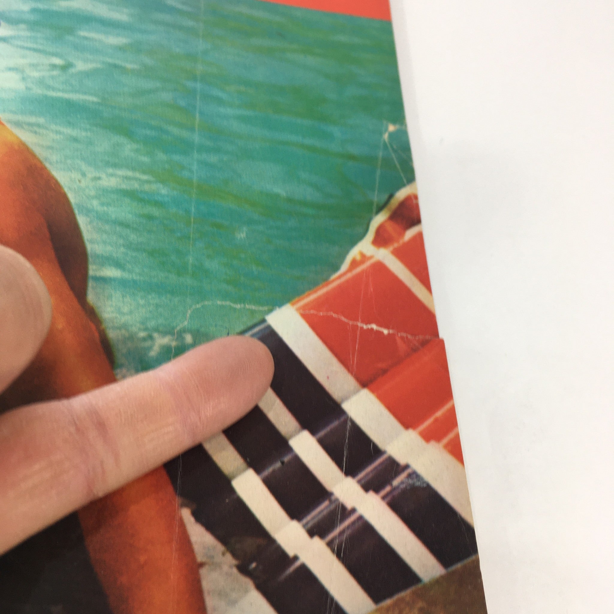 Detailed view of the swimsuit design and patterns on the cover of VTG American Girl Magazine: July 1975, highlighting nostalgic fashion elements.