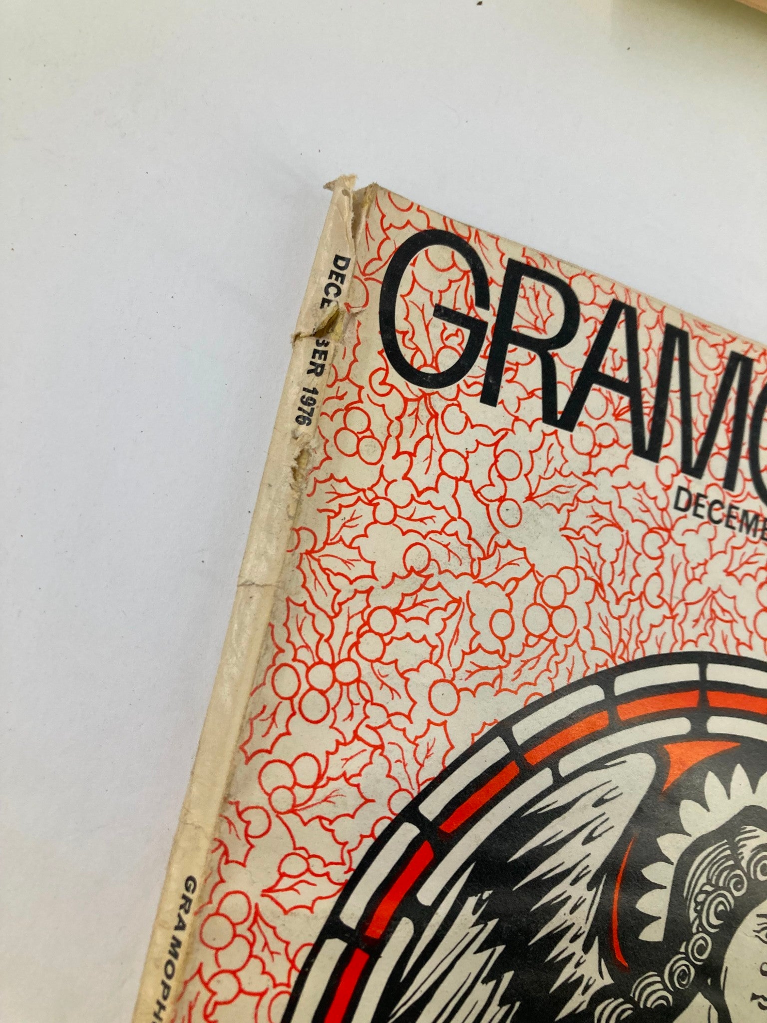 Side view of VTG Gramophone Magazine December 1976 Vol 54 #643, showing slight wear on the spine. The cover features a unique floral design with an angelic figure.