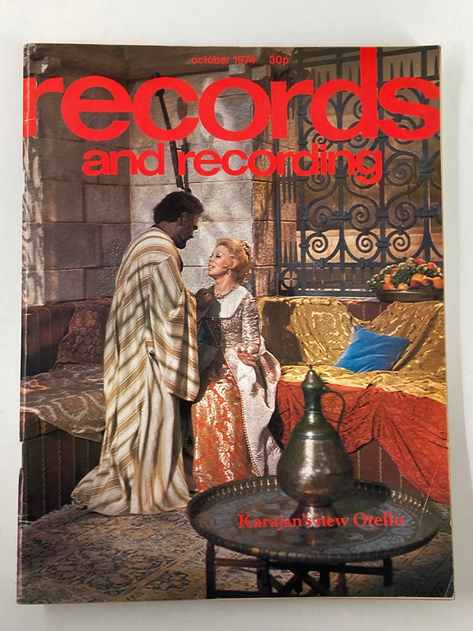 Cover of VTG Records & Recordings Magazine October 1974 featuring Karajan's New Otello, showcasing artwork with performers dressed in historical costumes.