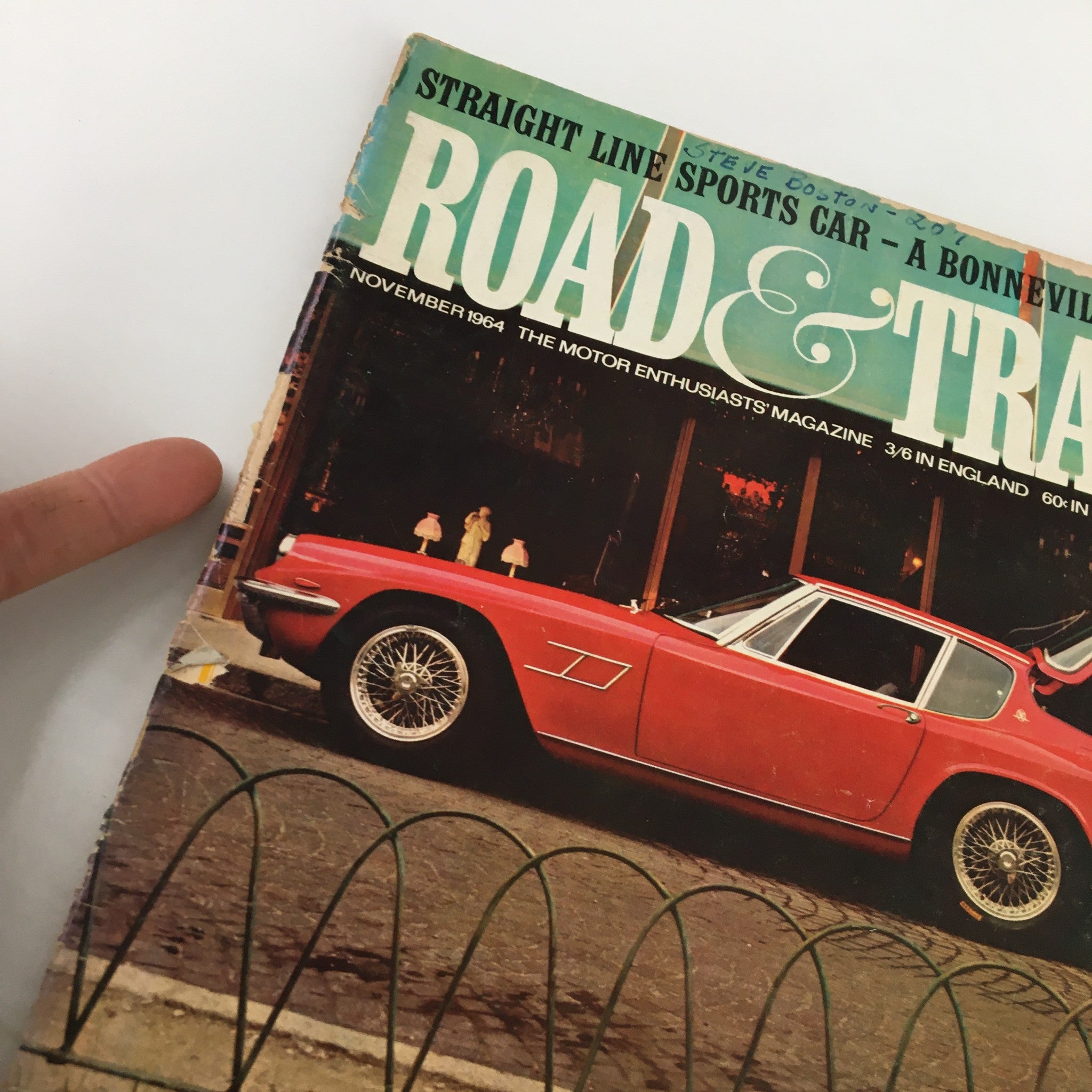 Close-up of the VTG Road and Track Magazine November 1964 cover emphasizing the vintage design and wear characteristics.