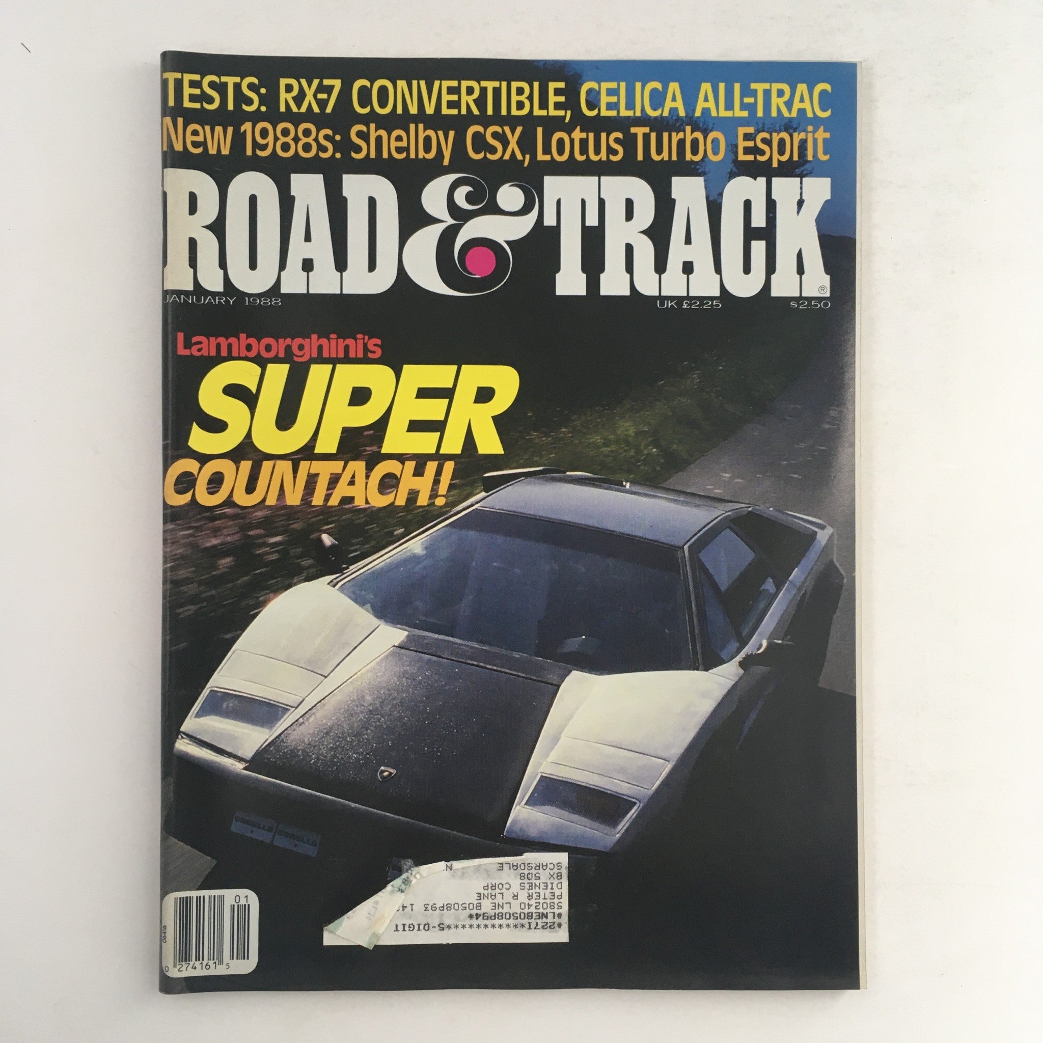 Cover of Road & Track Magazine January 1988 featuring tests on RX-7 Convertible and Celica All-Trac. Highlights Lamborghini's Super Countach with eye-catching graphics and vintage automotive design.