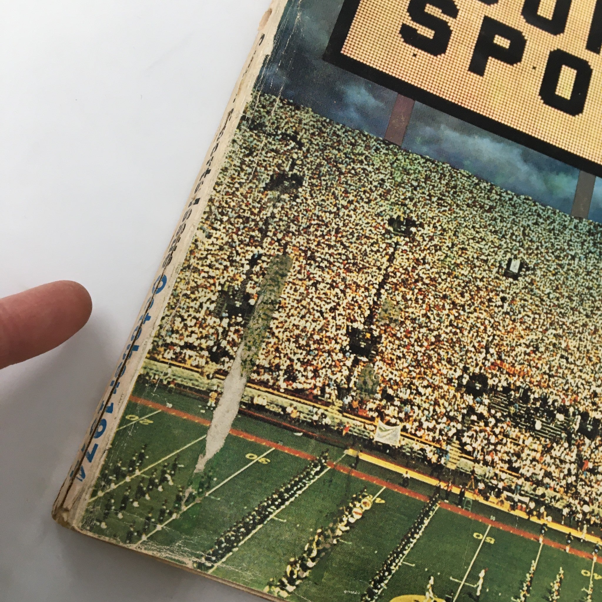 Side view of Esquire Magazine October 1974 cover highlighting the sports crowd and the 'Super Sports' title.