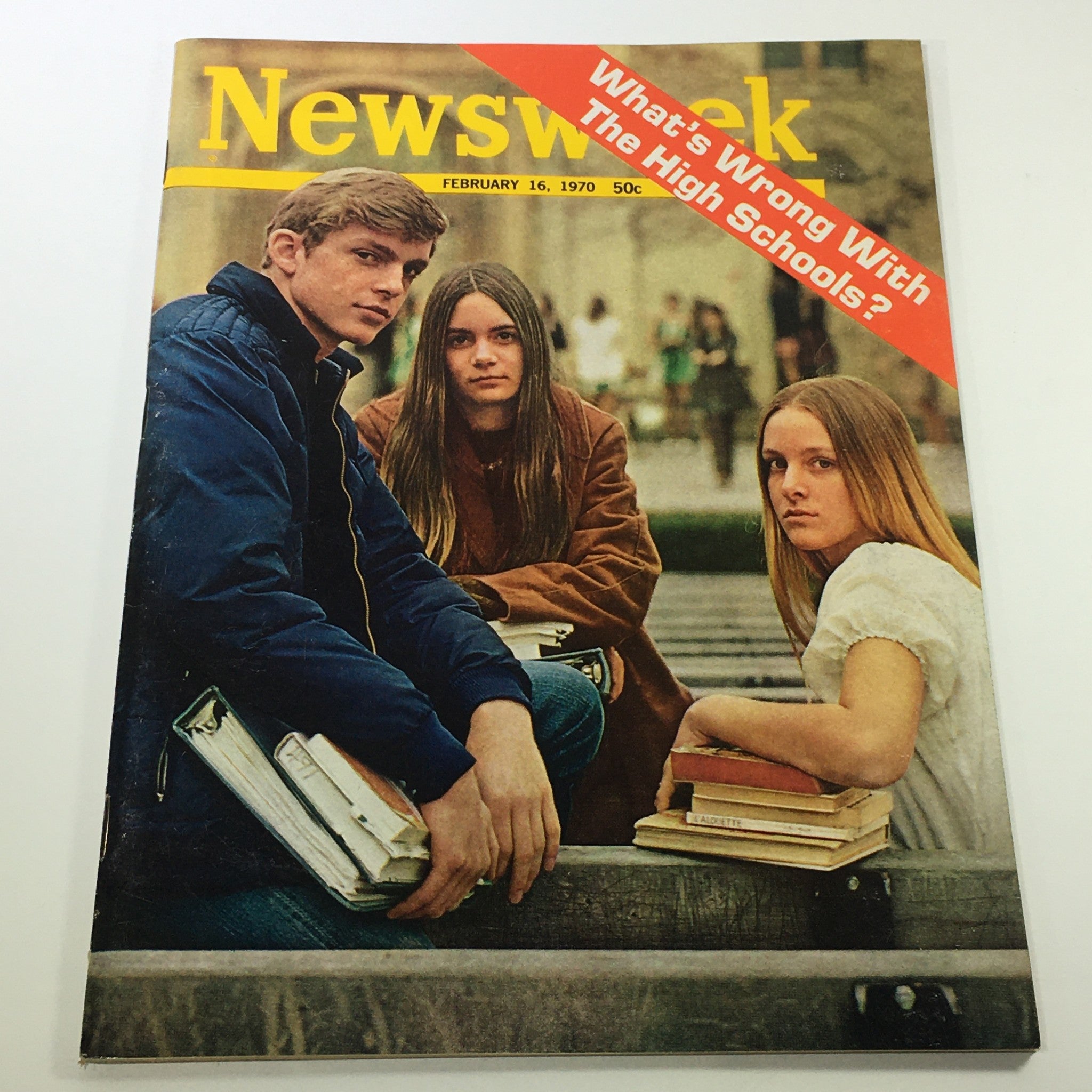 Vintage Newsweek Magazine cover from February 16, 1970, featuring three students, with the headline 'What's Wrong With The High Schools?'. This classic magazine explores educational issues of the time.