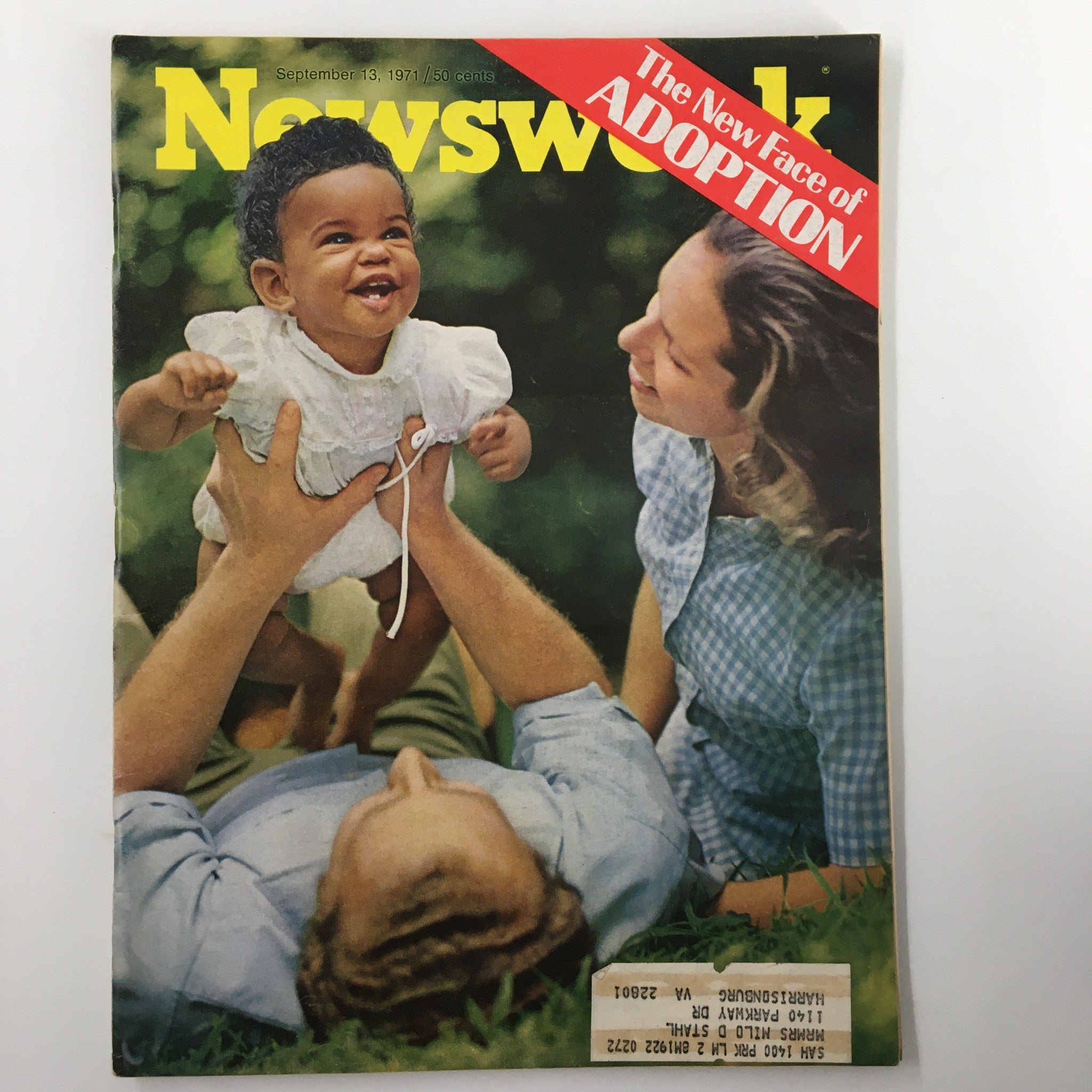 Vintage Newsweek magazine cover from September 13, 1971, featuring the title 'The New Face of Adoption.' The image depicts a joyful baby being lifted by a parent, symbolizing themes of family and adoption.