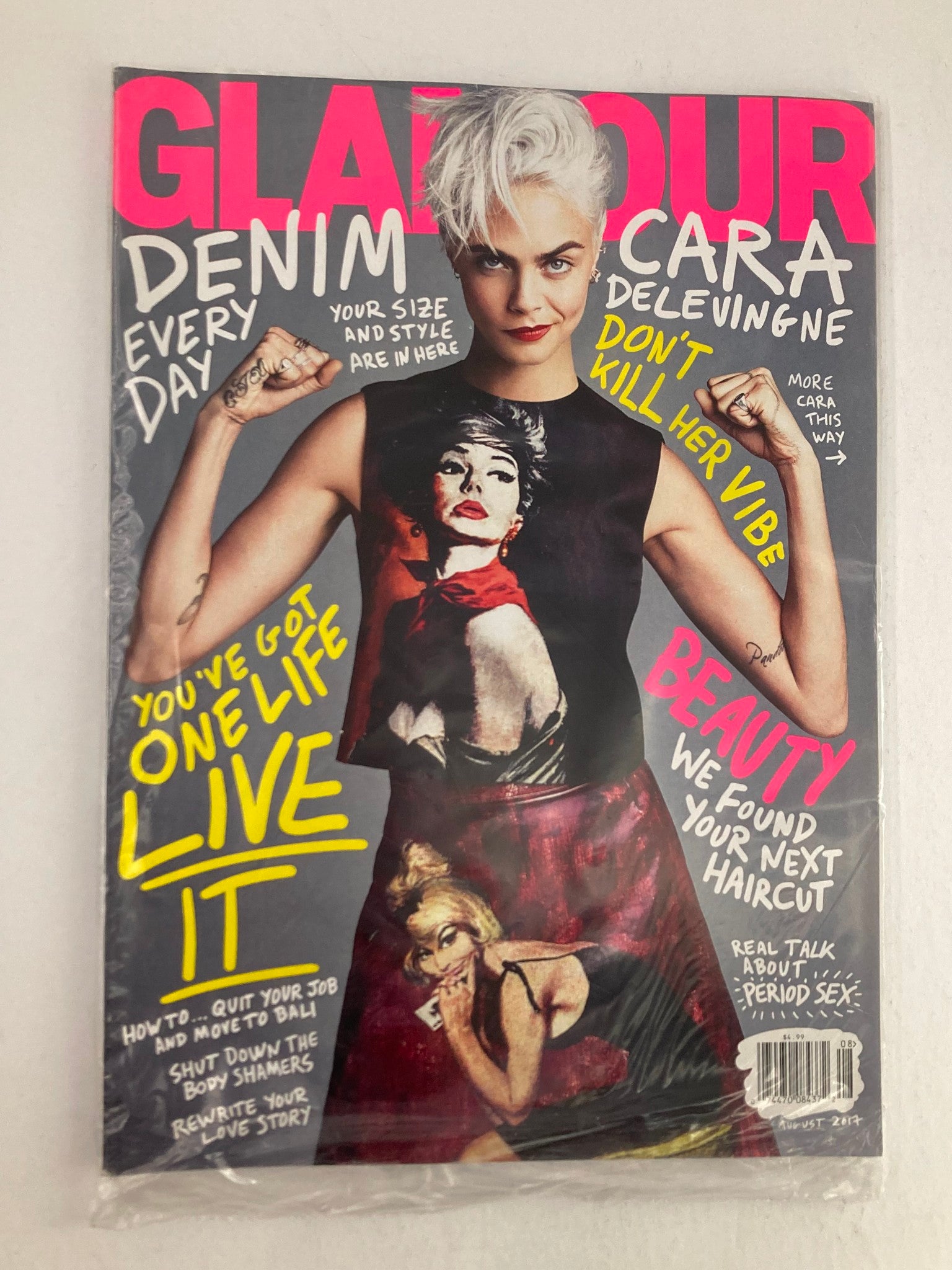 Glamour Magazine August 2017 featuring Cara Delevingne on the cover, showcasing her powerful pose and fashion style. The cover includes the text 'Don't Kill Her Vibe' and highlights themes of beauty and empowerment, making it a valuable collectible for fashion enthusiasts.