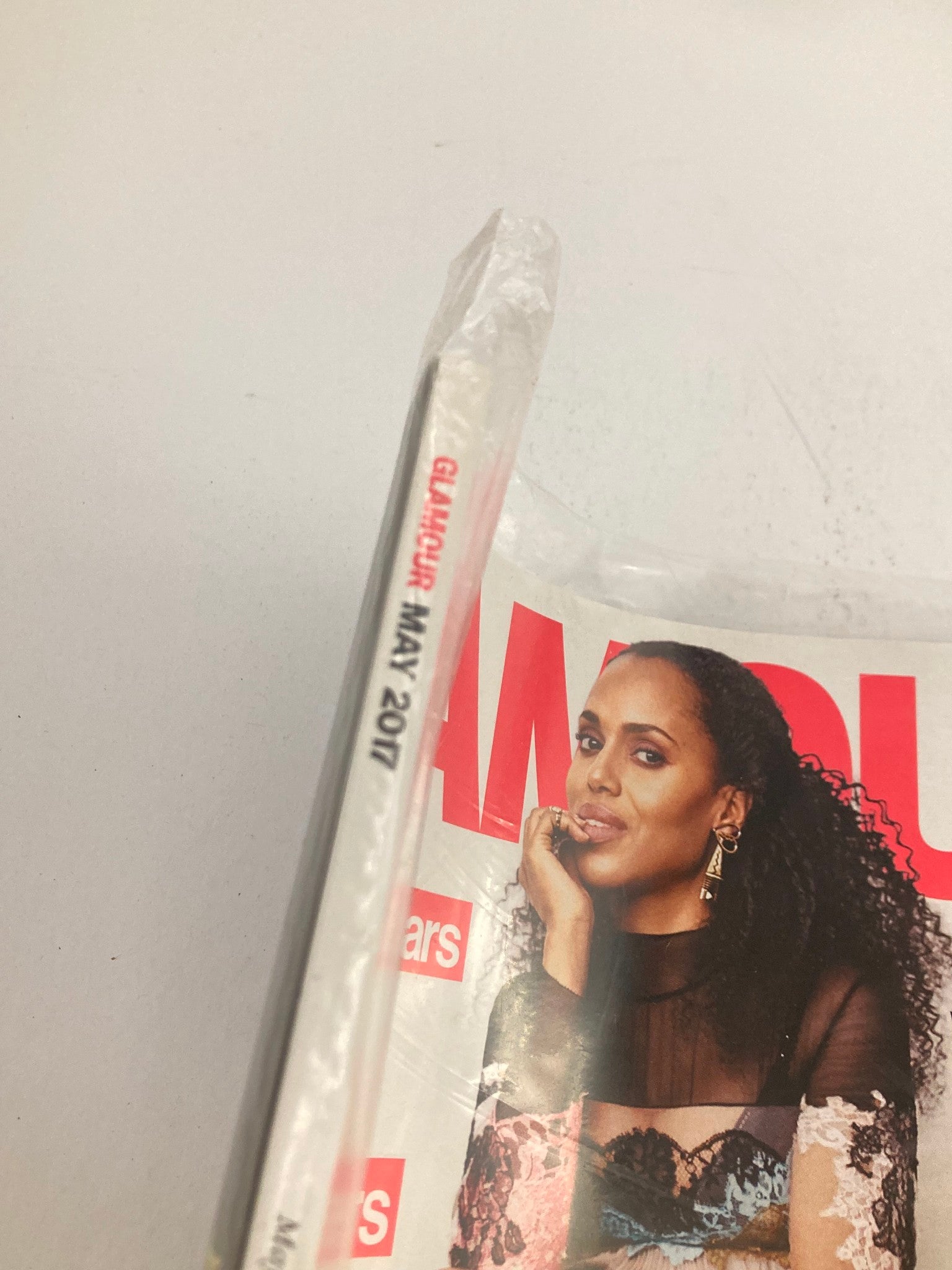 Spine view of Glamour Magazine May 2017 with 'GLAMOUR MAY 2017' text, showcasing the sealed magazine featuring Kerry Washington on the cover.