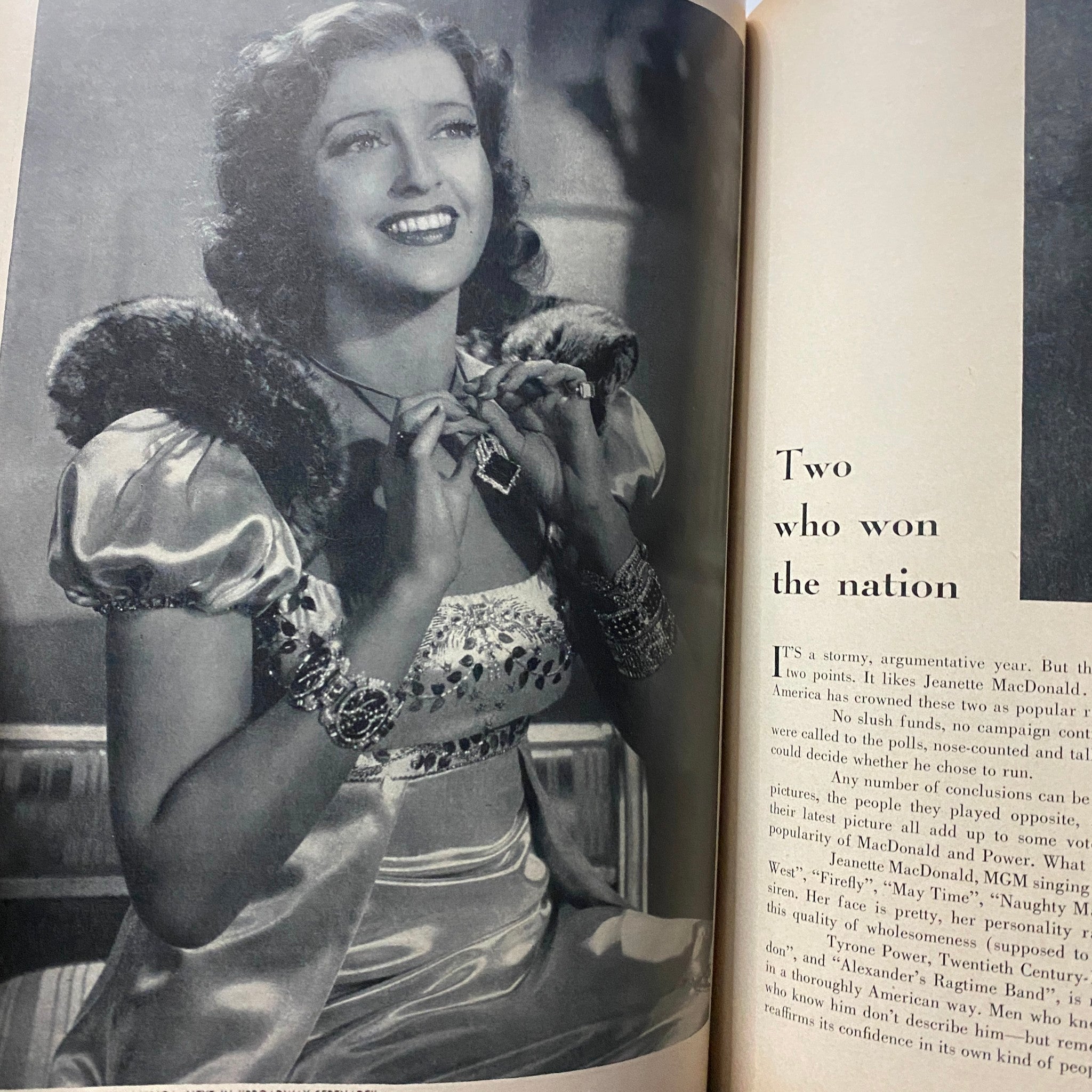 Photograph of a glamorous actress in GLAMOUR OF HOLLYWOOD Magazine April 1939, adorned with jewelry, capturing the essence of vintage Hollywood glamour.
