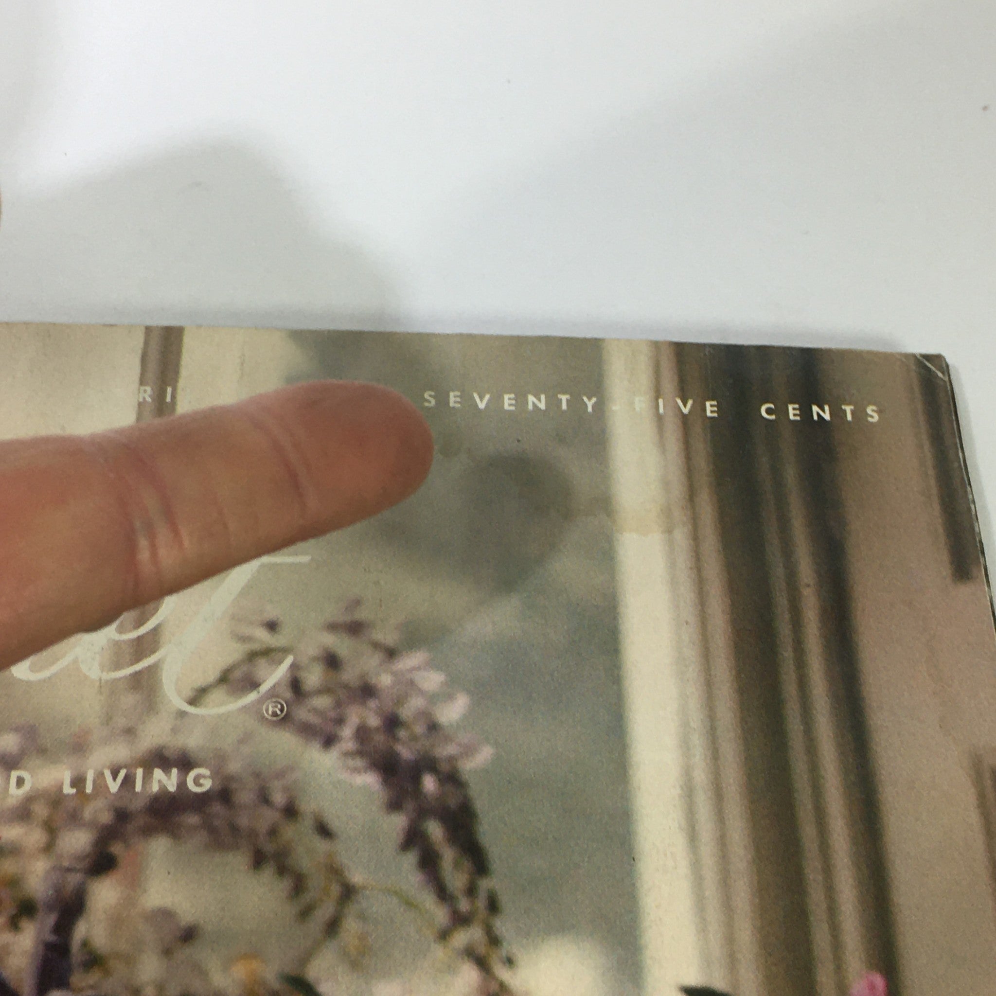 Close-up of the cover of VTG Gourmet: The Magazine of Good Living, April 1976 edition, highlighting the magazine title and price, emphasizing its collectible nature.