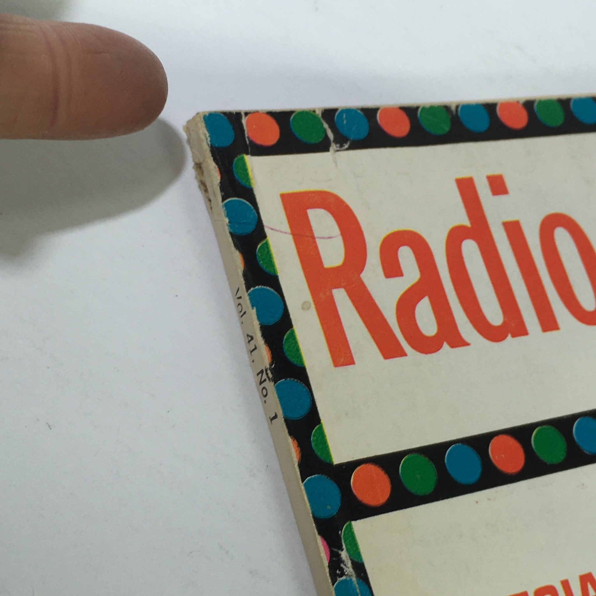 Close-up of the corner of VTG Radio-Electronics Magazine January 1970, featuring colorful polka dot design and title 'Radio' with visible wear on edges.