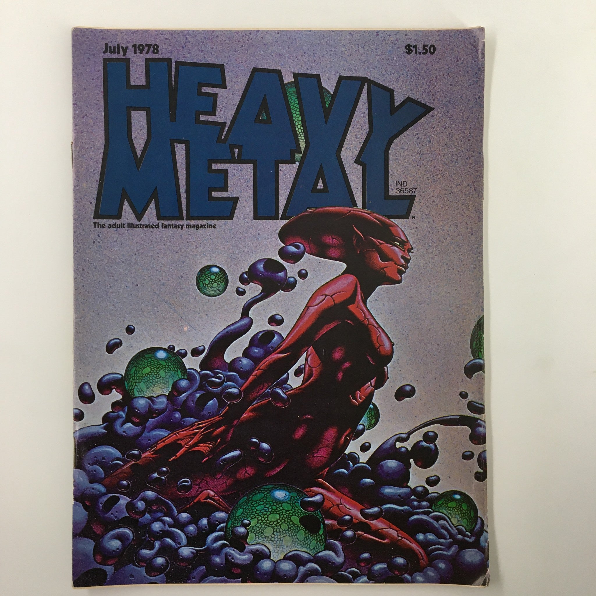 Cover of VTG Heavy Metal Magazine July 1978 Vol II #3 featuring striking artwork of a fantasy figure set against colorful bubbles, representing 'The Death of Orlaon'.